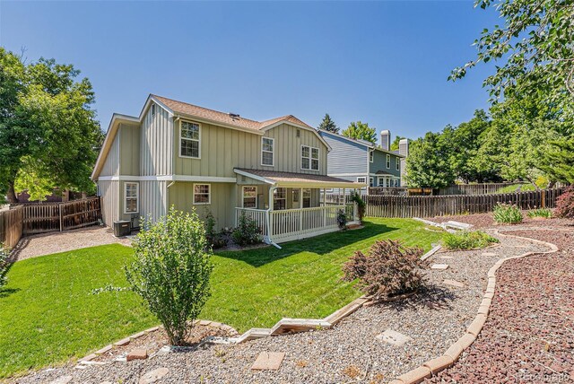 9948 King St, Westminster, CO 80031 - back of property featuring a shingled roof, a fenced backyard, board and batten siding, and a porch