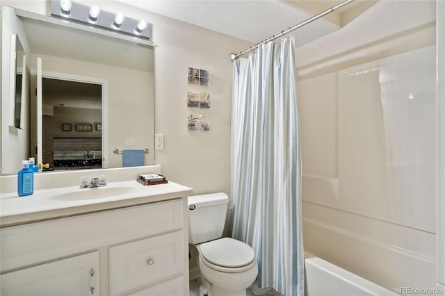 full bathroom with vanity, toilet, and shower / bath combo with shower curtain