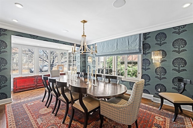 dining room featuring crown molding, baseboards, and wallpapered walls