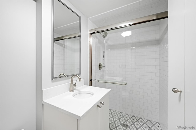 full bath featuring a stall shower and vanity