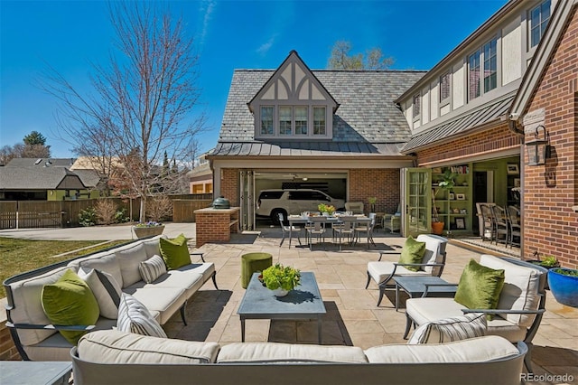 view of patio / terrace with an outdoor living space, outdoor dining space, and fence