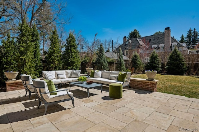 view of patio / terrace with an outdoor living space and fence