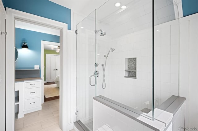 ensuite bathroom featuring connected bathroom and a shower stall