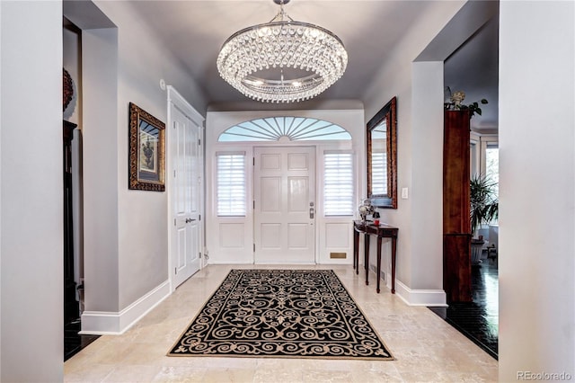 entrance foyer with a chandelier