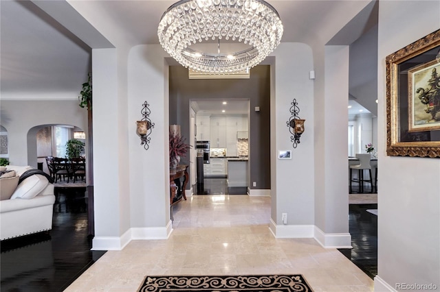 entrance foyer featuring an inviting chandelier