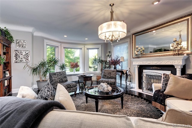 living room with crown molding and an inviting chandelier