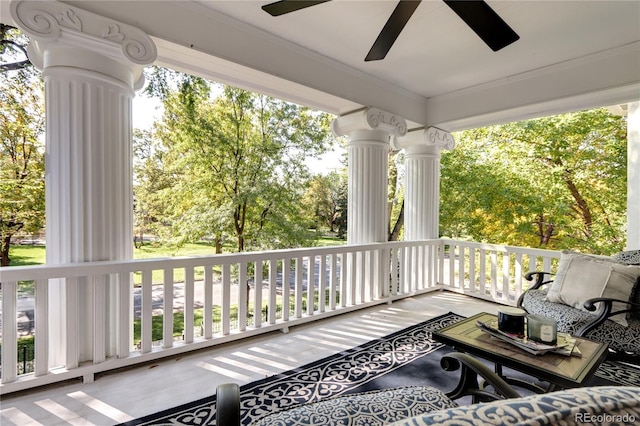 wooden terrace featuring ceiling fan