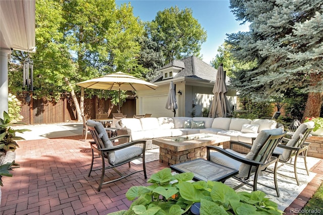 view of patio / terrace featuring an outdoor living space with a fire pit