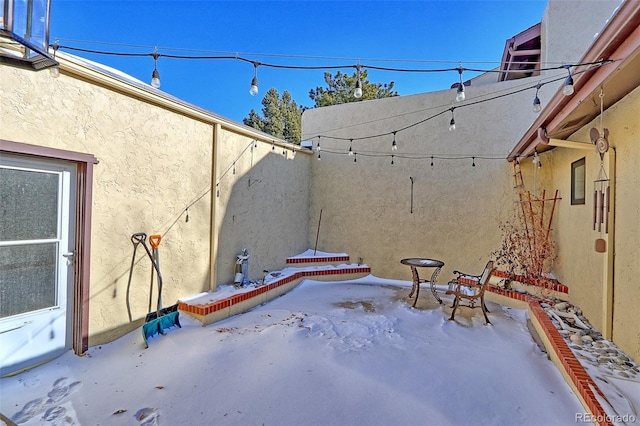 view of snow covered patio