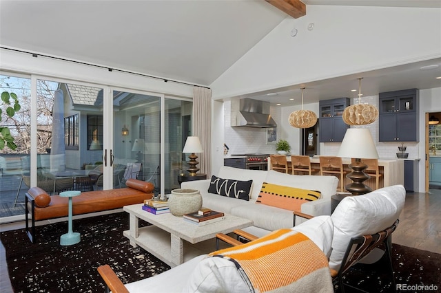 living room featuring beam ceiling, dark hardwood / wood-style flooring, and high vaulted ceiling