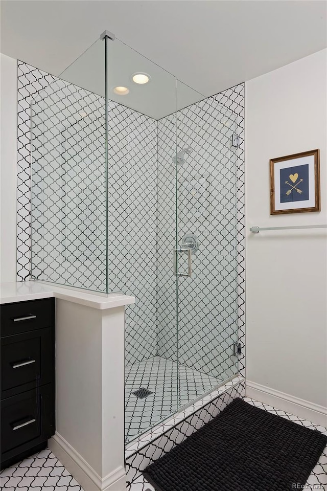 bathroom featuring a shower with door