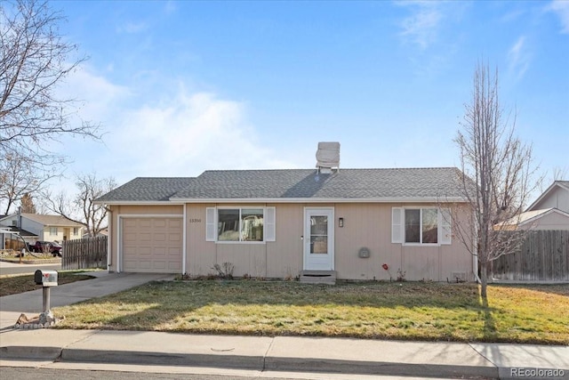 ranch-style home featuring a front lawn and a garage