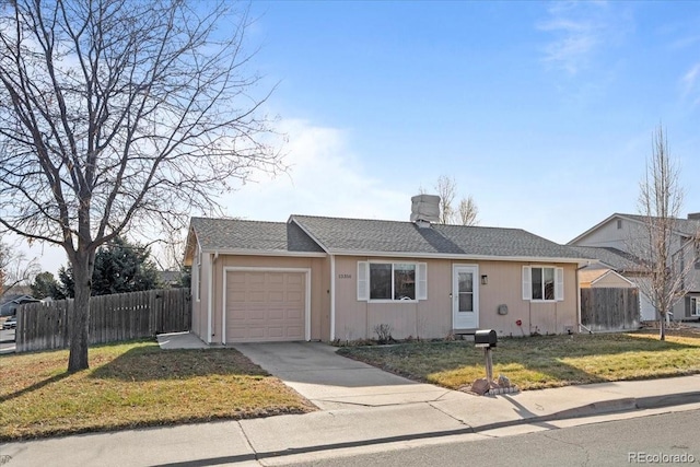 single story home featuring a garage and a front yard