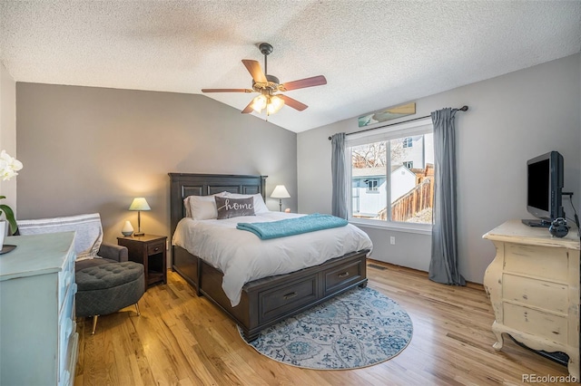 8893 W Ontario Ave, Littleton, CO 80128 - bedroom featuring ceiling fan, a textured ceiling, light wood-style floors, and lofted ceiling