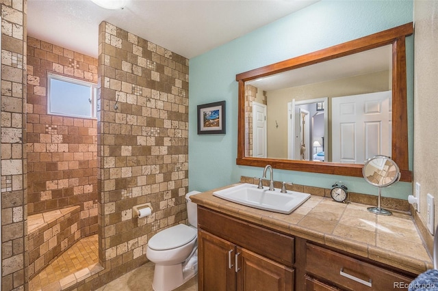 8893 W Ontario Ave, Littleton, CO 80128 - full bath featuring toilet, a walk in shower, and vanity