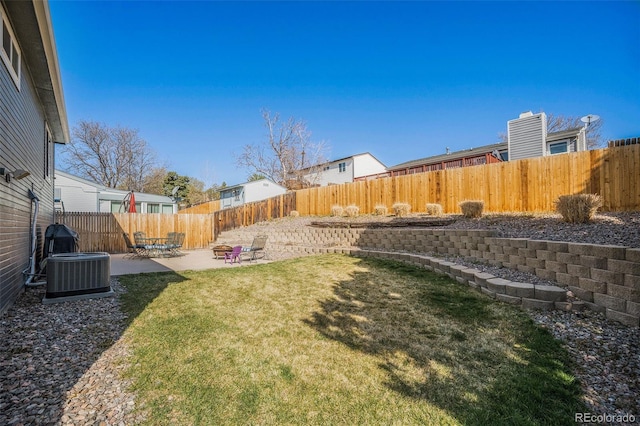 8893 W Ontario Ave, Littleton, CO 80128 - view of yard with a patio area, a fenced backyard, and central AC unit