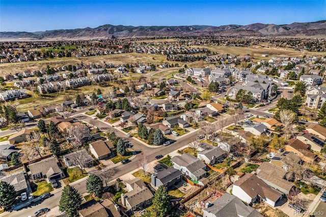 8893 W Ontario Ave, Littleton, CO 80128 - drone / aerial view with a residential view and a mountain view