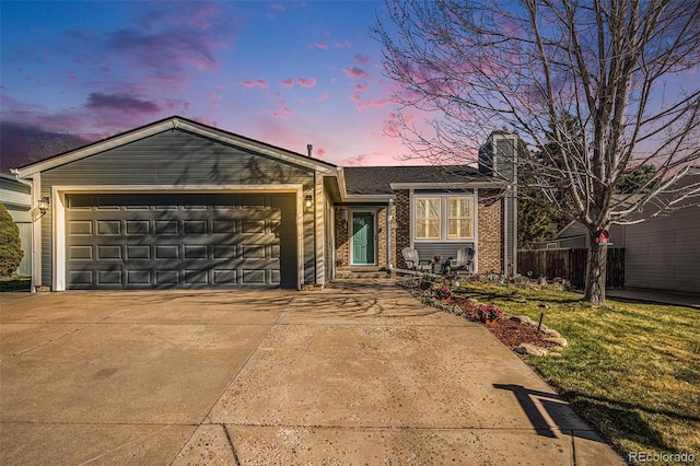 8893 W Ontario Ave, Littleton, CO 80128 - ranch-style home featuring an attached garage, a chimney, concrete driveway, and brick siding