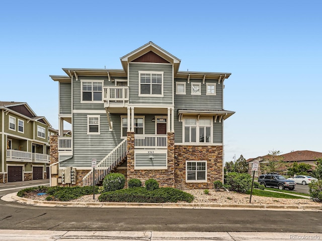 9363 Amison Cir Unit 106, Parker, CO 80134 - multi unit property with stone siding, a balcony, a porch, and stairway