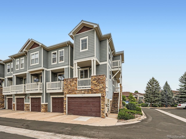 9363 Amison Cir Unit 106, Parker, CO 80134 - view of property with stone siding and a garage