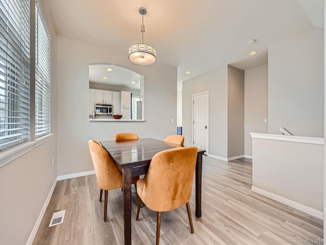 9363 Amison Cir Unit 106, Parker, CO 80134 - dining area featuring light wood-type flooring, healthy amount of natural light, baseboards, and recessed lighting