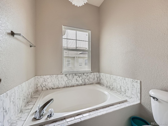 9363 Amison Cir Unit 106, Parker, CO 80134 - full bath featuring a garden tub, toilet, and a textured wall