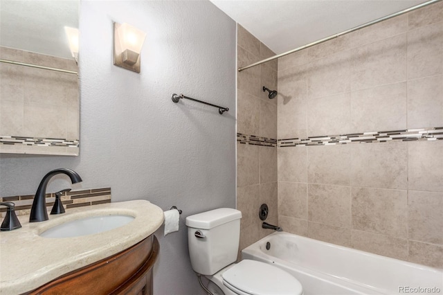 full bath with vanity,  shower combination, a textured wall, and toilet