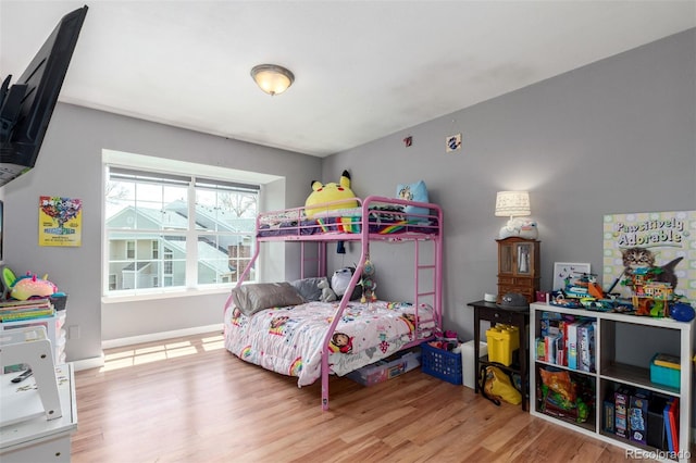bedroom with wood finished floors