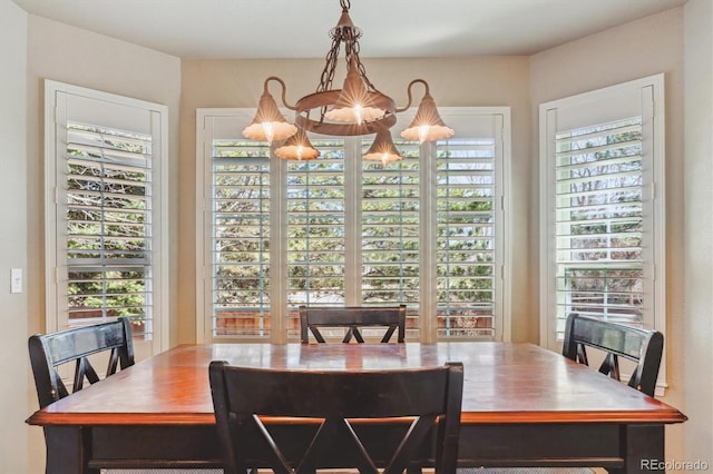 dining area featuring a chandelier