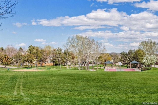 view of home's community with a gazebo and a yard