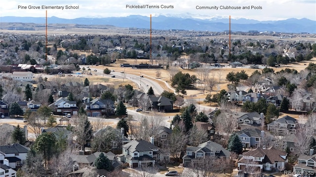 drone / aerial view with a residential view and a mountain view