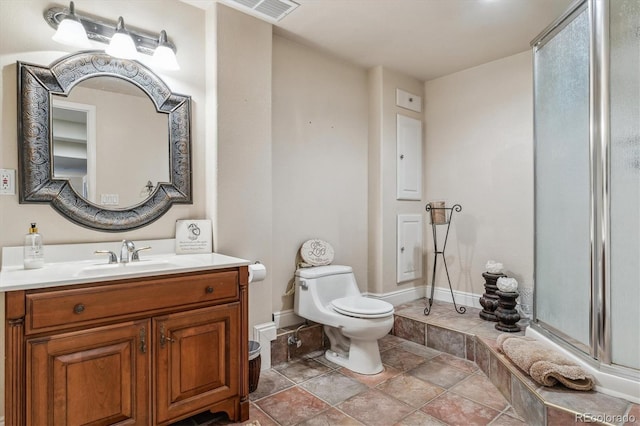 16302 Parkside Dr, Parker, CO 80134 - bathroom with a shower with door, baseboards, toilet, vanity, and stone finish flooring