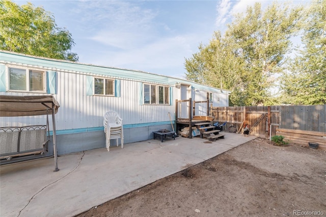 back of house with a patio area