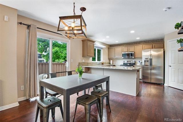 1179 S Alton Ct, Denver, CO 80247 - dining space featuring a chandelier, recessed lighting, dark wood finished floors, and baseboards