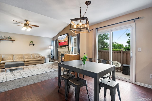 1179 S Alton Ct, Denver, CO 80247 - dining room with a chandelier, lofted ceiling, ceiling fan, wood finished floors, and baseboards