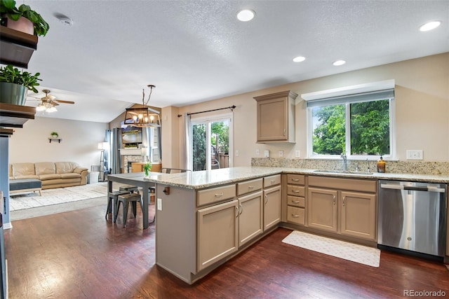1179 S Alton Ct, Denver, CO 80247 - kitchen with dishwasher, a sink, a peninsula, ceiling fan, and open floor plan