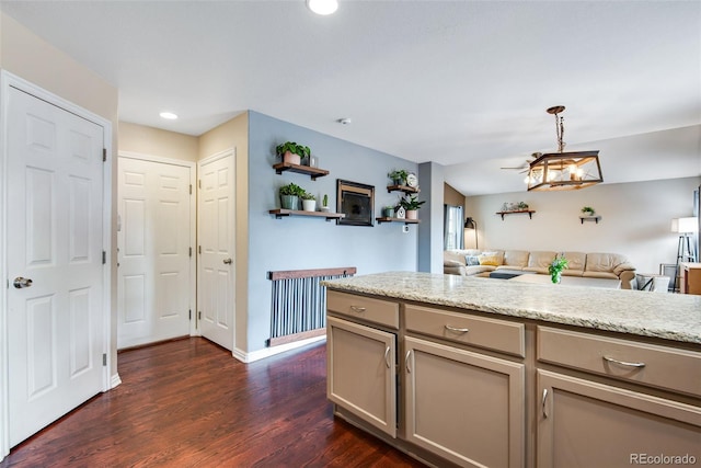 1179 S Alton Ct, Denver, CO 80247 - kitchen featuring dark wood-style floors, open floor plan, recessed lighting, baseboards, and hanging light fixtures