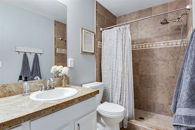 1179 S Alton Ct, Denver, CO 80247 - bathroom with vanity, toilet, and a tile shower