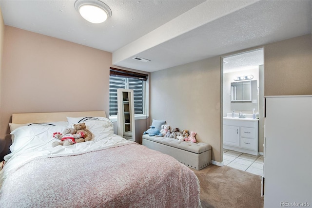 1179 S Alton Ct, Denver, CO 80247 - bedroom with light colored carpet, light tile patterned floors, and ensuite bathroom