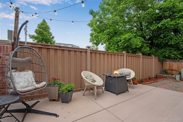 1179 S Alton Ct, Denver, CO 80247 - fenced backyard with a patio area and an outdoor fire pit