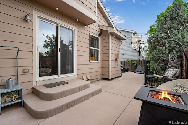 1179 S Alton Ct, Denver, CO 80247 - view of patio with a fire pit