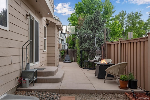 1179 S Alton Ct, Denver, CO 80247 - fenced backyard featuring a fire pit and a patio area