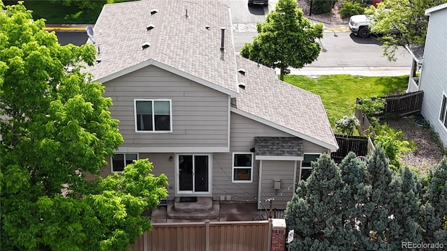 1179 S Alton Ct, Denver, CO 80247 - back of property featuring roof with shingles and a patio area