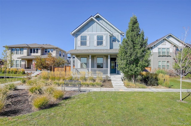 view of front facade featuring a front lawn and covered porch