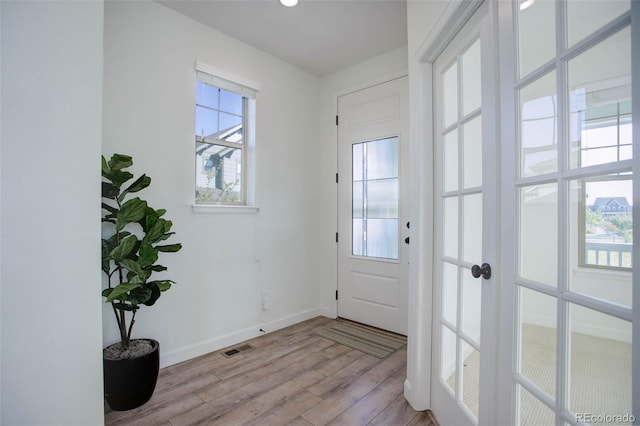 doorway to outside with light hardwood / wood-style flooring