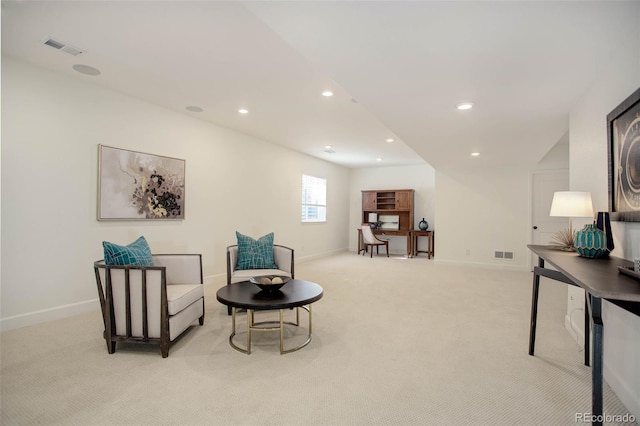 sitting room with light colored carpet