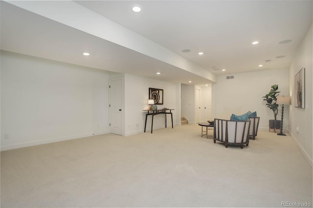 living area with light colored carpet