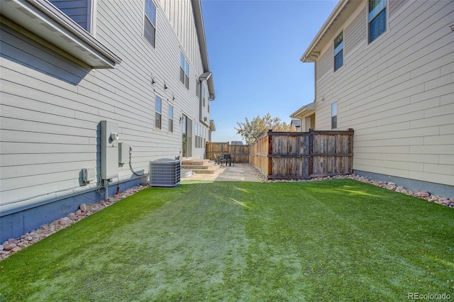 view of yard with a patio and cooling unit