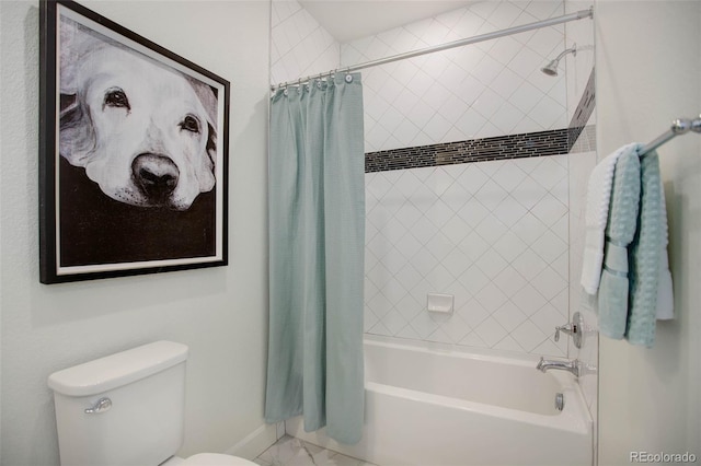 bathroom with shower / bath combo with shower curtain and toilet