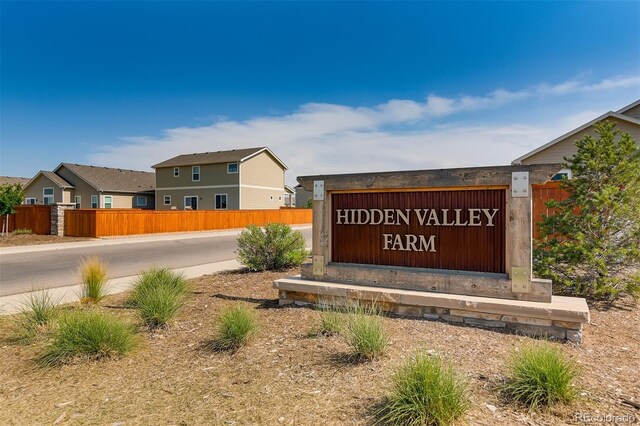 community sign with fence